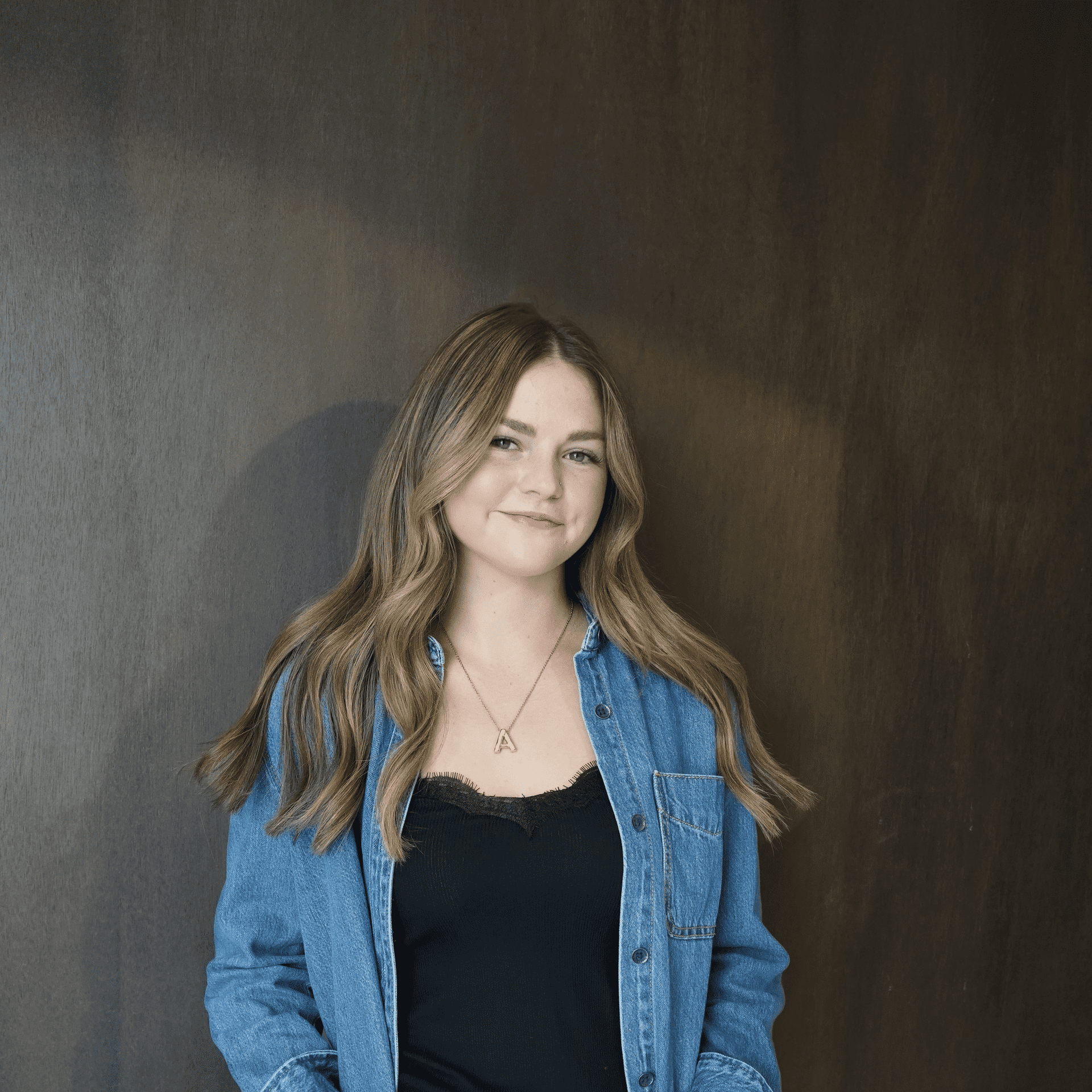 Portrait of Alison Smith, a professional stylist at Salt and Waves Salon, showcasing their expertise and style.