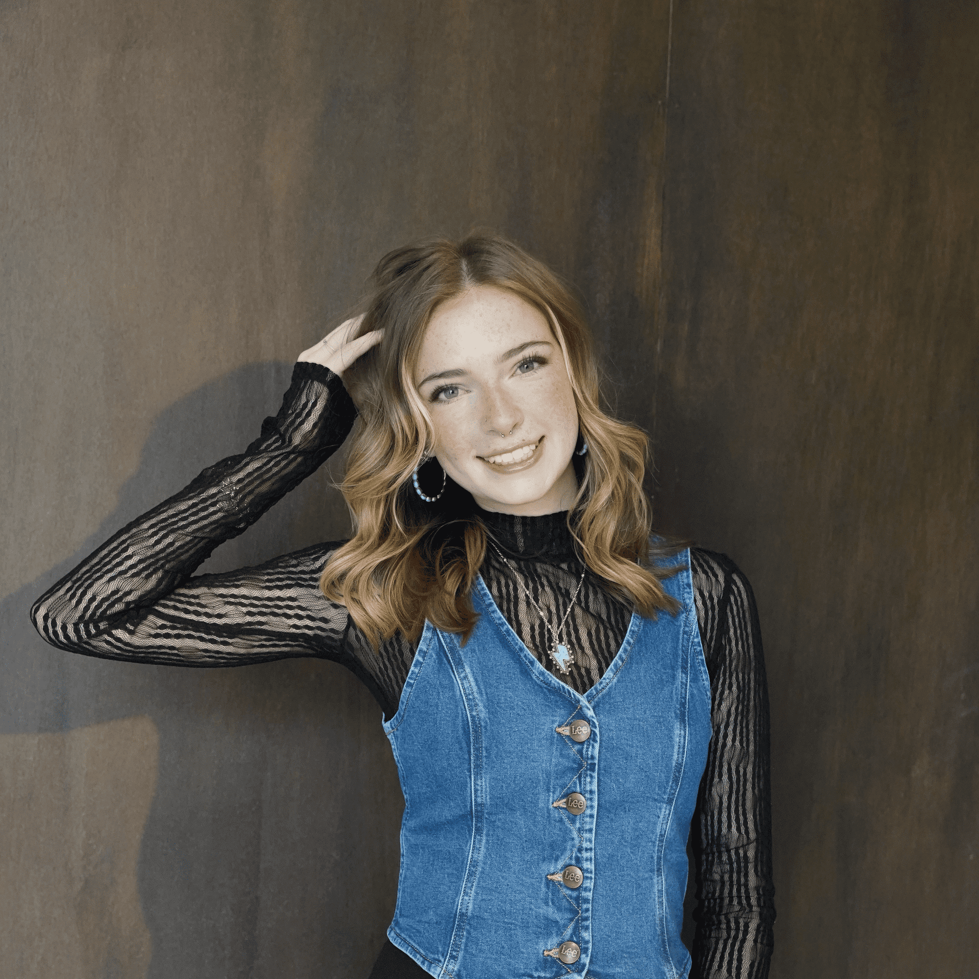 Portrait of KenLea DeMoss, a professional stylist at Salt and Waves Salon, showcasing their expertise and style.