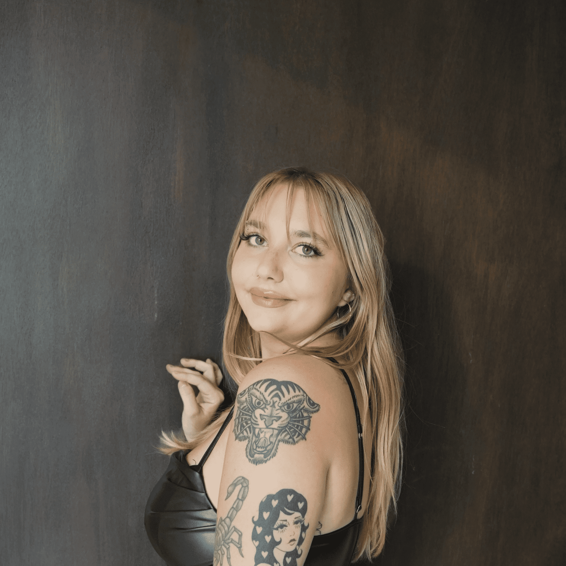 Portrait of Kayleigh Goines, a professional stylist at Salt and Waves Salon, showcasing their expertise and style.