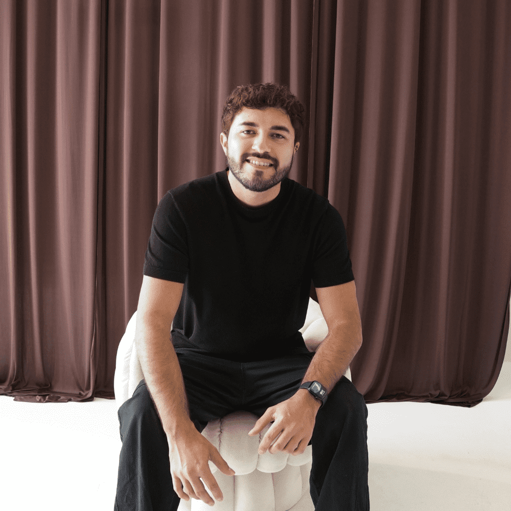 Portrait of Val Martinez, a professional stylist at Salt and Waves Salon, showcasing their expertise and style.