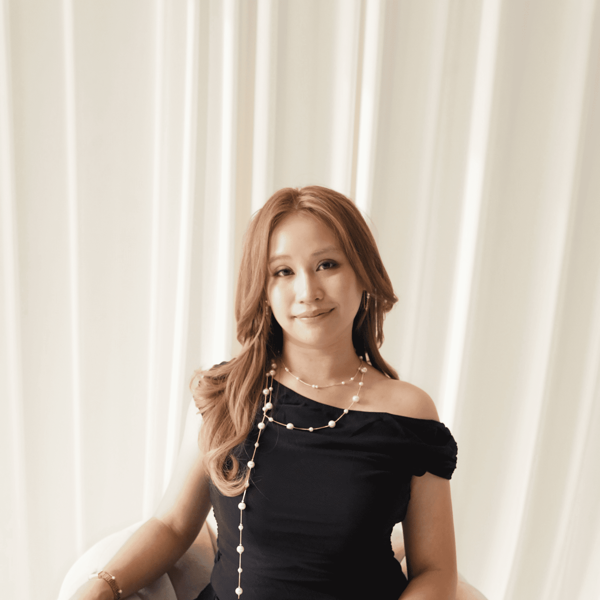 Portrait of Ann Nguyen, a professional stylist at Salt and Waves Salon, showcasing their expertise and style.