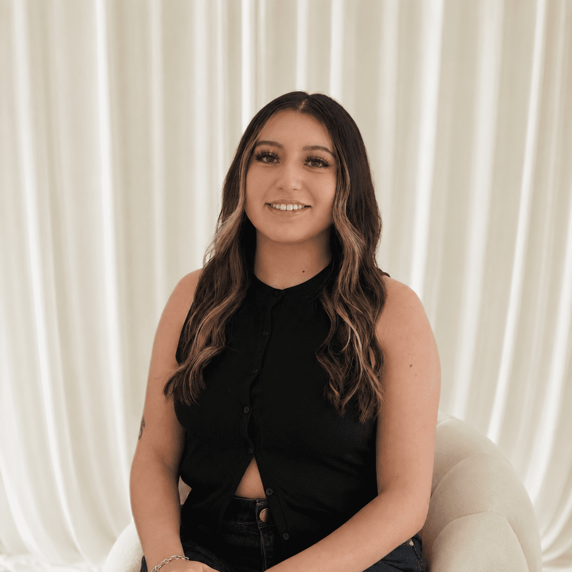Portrait of Alyssa Terrazas-Fuentes, a professional stylist at Salt and Waves Salon, showcasing their expertise and style.