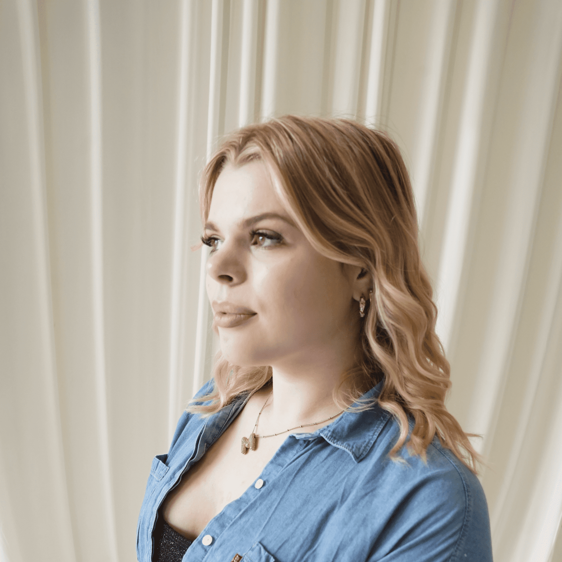 Portrait of Maya Miles, a professional stylist at Salt and Waves Salon, showcasing their expertise and style.