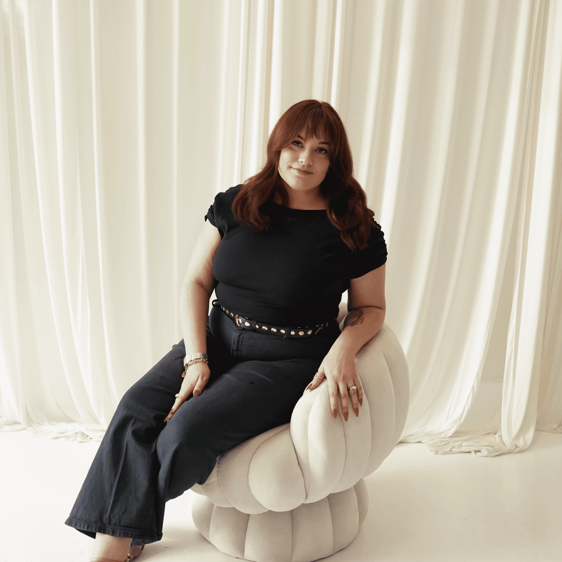 Portrait of Kenzie Foster, a professional stylist at Salt and Waves Salon, showcasing their expertise and style.