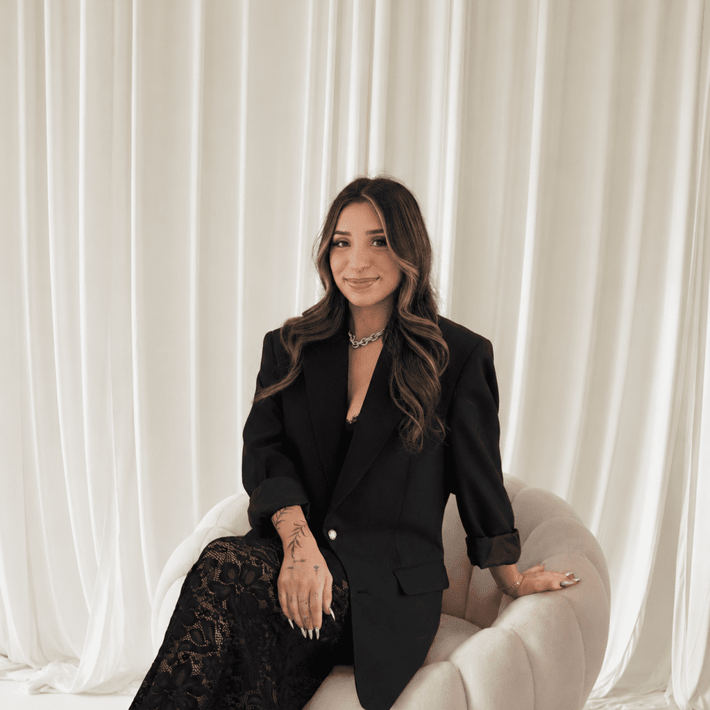Portrait of Ariana Cosme, a professional stylist at Salt and Waves Salon, showcasing their expertise and style.